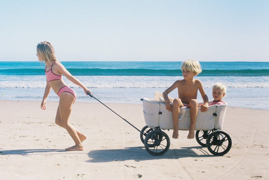 Dunes beach cart loaded with beach gear being pulled across sand