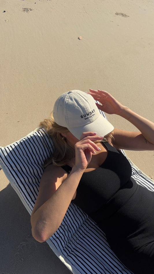 A Natural Instinct beach lounger set up on the sand at Dreamtime Beach.