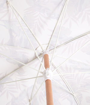 Sunday Supply Co Bayleaf beach umbrella open and seen from underneath.